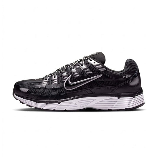 Lateral profile view of the Nike P-6000 Black White Metallic Silver sneaker showcasing a black mesh upper with metallic silver overlays, silver Swoosh outline, white foam midsole, and black rubber outsole.