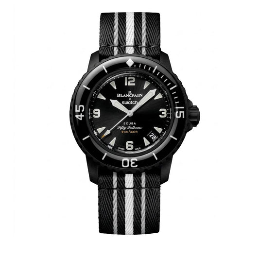 Front face view of the Blancpain x Swatch Scuba Fifty Fathoms Ocean of Storms watch (SO35B400) featuring a black Bioceramic case, black sunray dial, unidirectional rotating bezel, and a black and white striped NATO strap.
