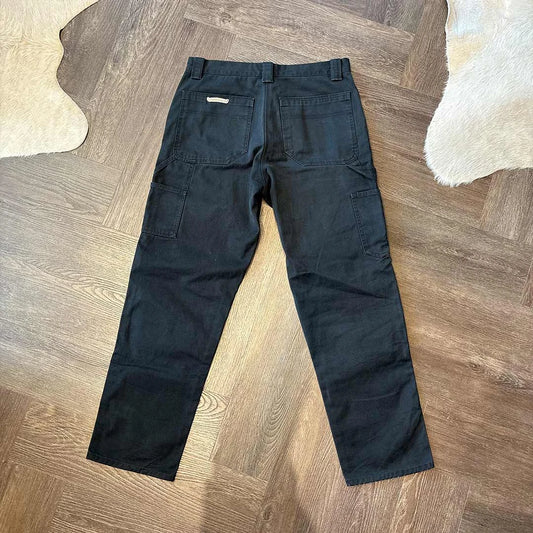 Chrome Hearts cross rivets on black carpenter jeans