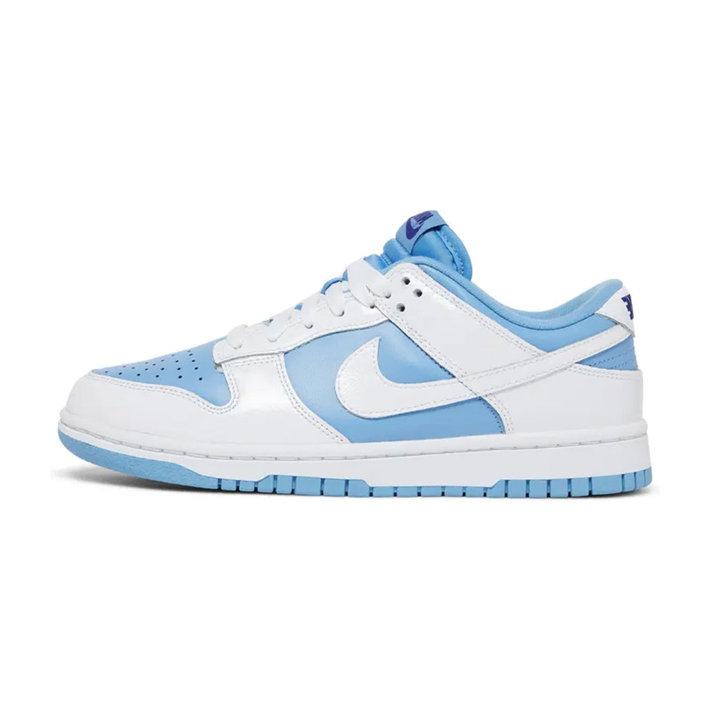 Lateral profile view of the Nike Dunk Low Reverse UNC sneaker featuring a University Blue leather base, crisp white leather overlays, white Swoosh, white midsole, and blue rubber outsole