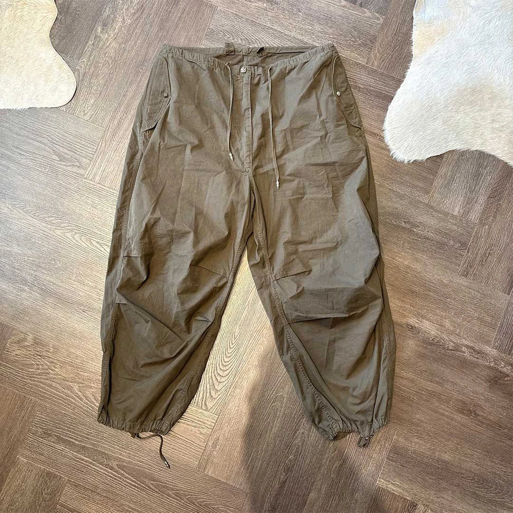 Chrome Hearts olive parachute pants with silver hardware luxury streetwear fashion